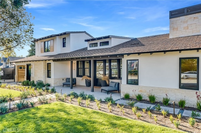 427 Santa Ana Ave, Newport Beach, CA 92663 - back of house featuring stucco siding, a patio, stone siding, and a lawn