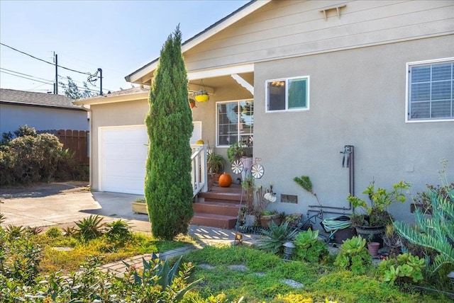 doorway to property featuring a garage