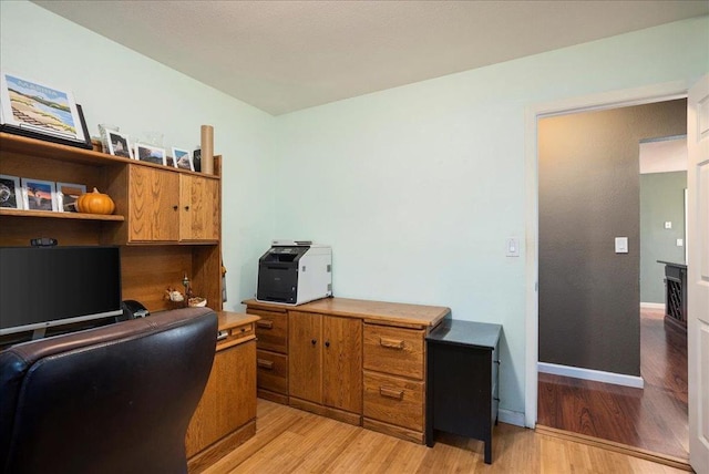 office area with light hardwood / wood-style flooring