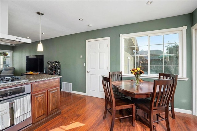 dining area featuring dark hardwood / wood-style floors