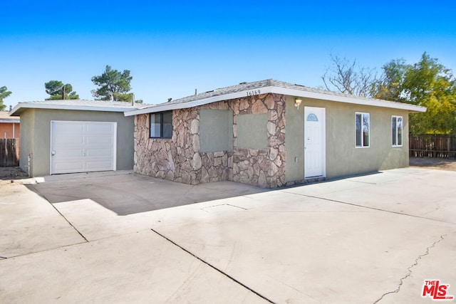 ranch-style home featuring a garage