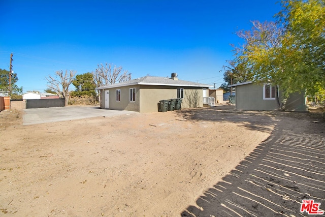 rear view of house featuring a patio