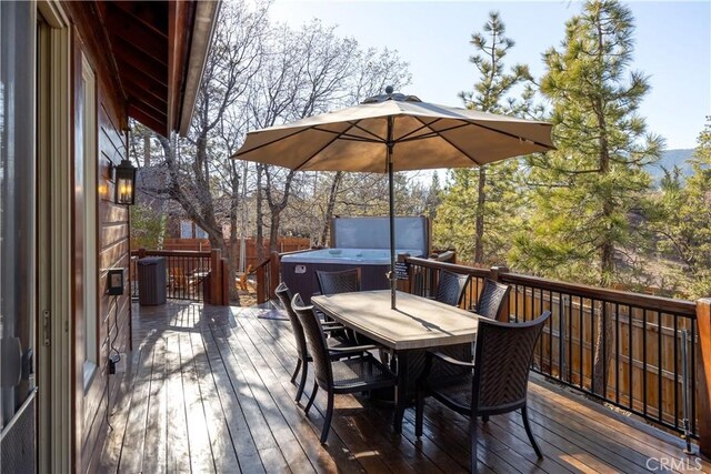 wooden deck with central AC unit and a hot tub