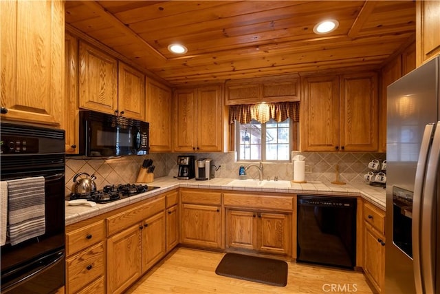 kitchen with light wood-type flooring, backsplash, wood ceiling, sink, and black appliances