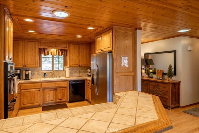 kitchen with tile countertops, dishwasher, light hardwood / wood-style flooring, decorative backsplash, and stainless steel fridge with ice dispenser