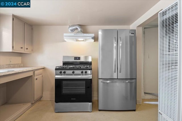 kitchen featuring stainless steel appliances and range hood