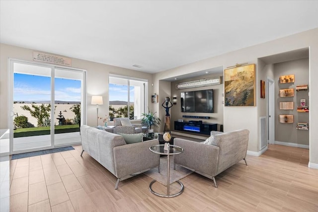 living room with light hardwood / wood-style flooring