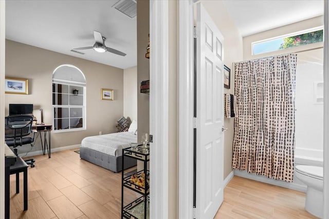 bedroom featuring ceiling fan and light hardwood / wood-style flooring