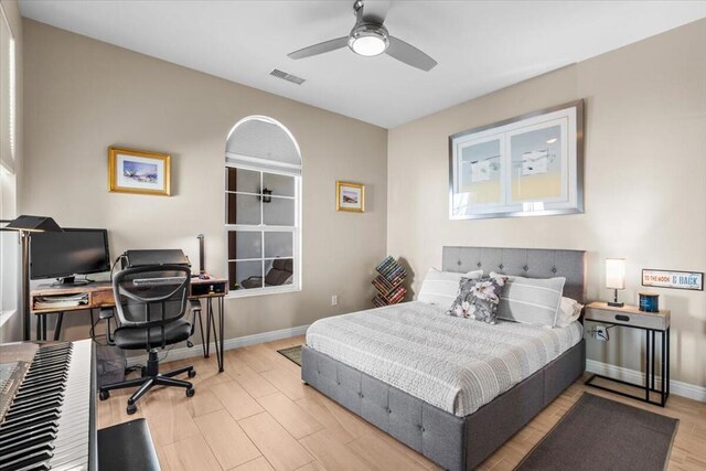 bedroom with ceiling fan and light hardwood / wood-style flooring