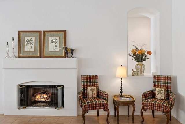 sitting room with tile patterned floors