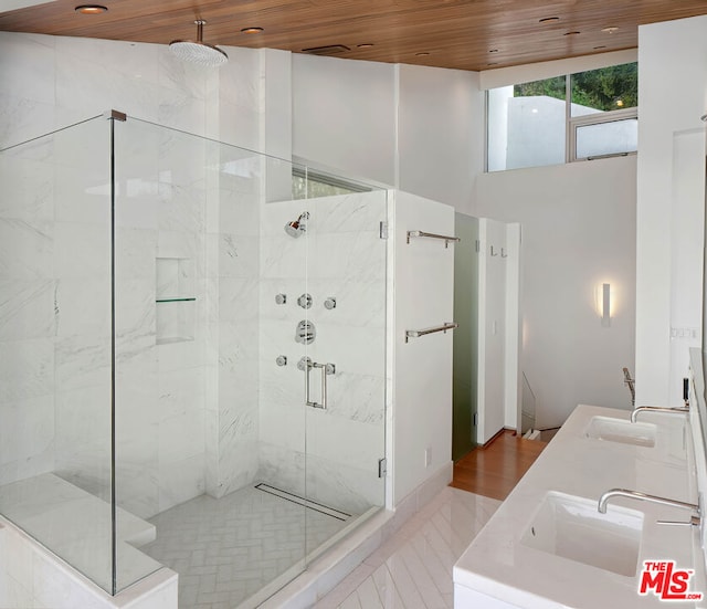 bathroom with hardwood / wood-style floors, vanity, an enclosed shower, and wooden ceiling