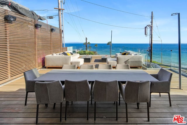 wooden terrace with a water view