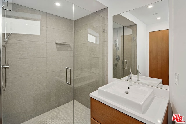 bathroom with vanity and an enclosed shower