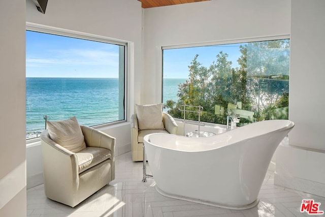 sitting room featuring a water view