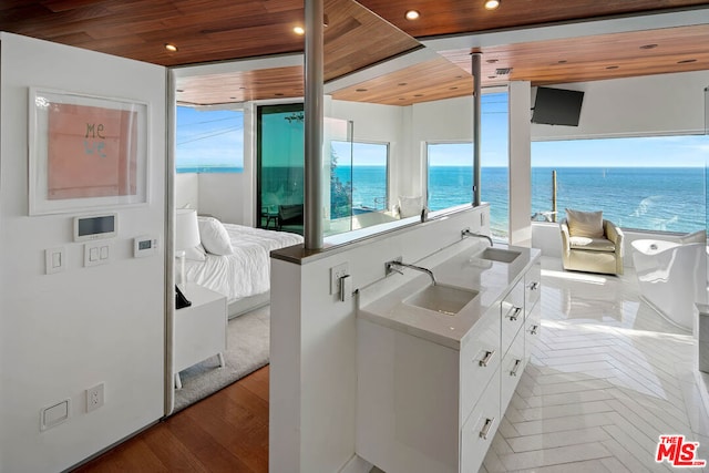 bathroom featuring hardwood / wood-style floors, vanity, and wood ceiling