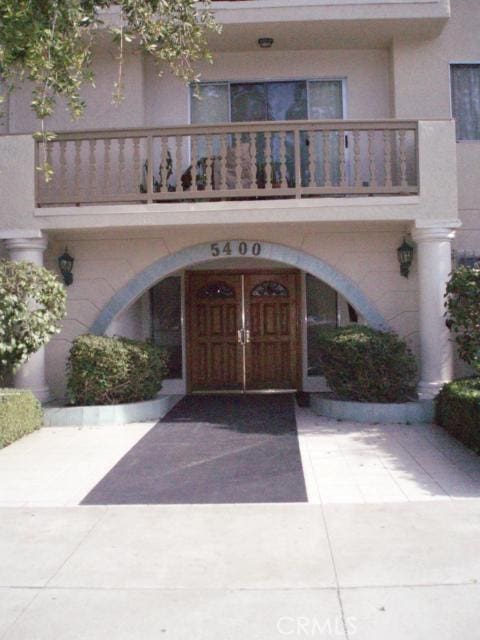 doorway to property with a balcony