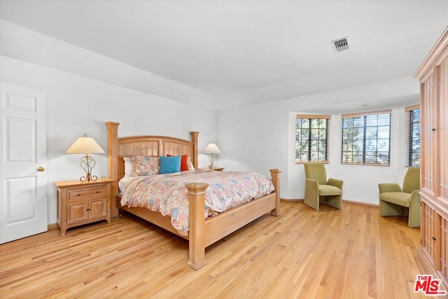 bedroom with light hardwood / wood-style floors