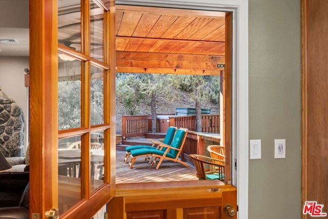 sunroom with wooden ceiling