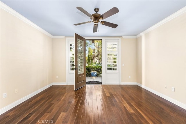 spare room featuring ceiling fan, dark hardwood / wood-style flooring, and crown molding