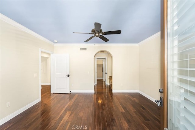 unfurnished room with ceiling fan, dark hardwood / wood-style flooring, and ornamental molding