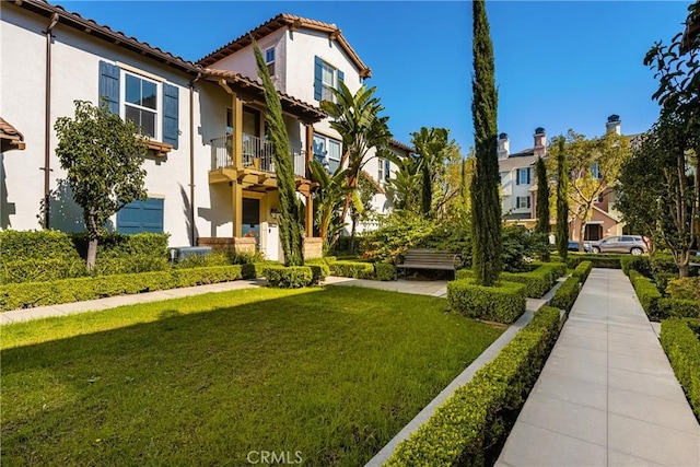 view of property's community with a lawn