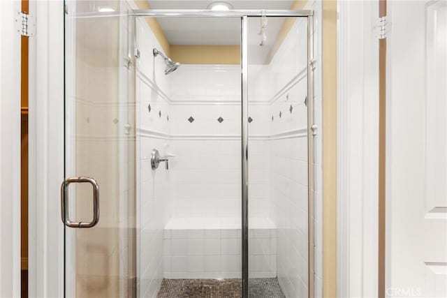 bathroom featuring an enclosed shower