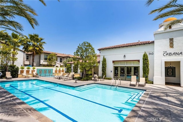 view of swimming pool with a patio area