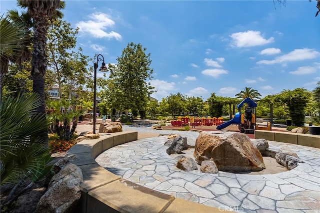 view of home's community with a playground