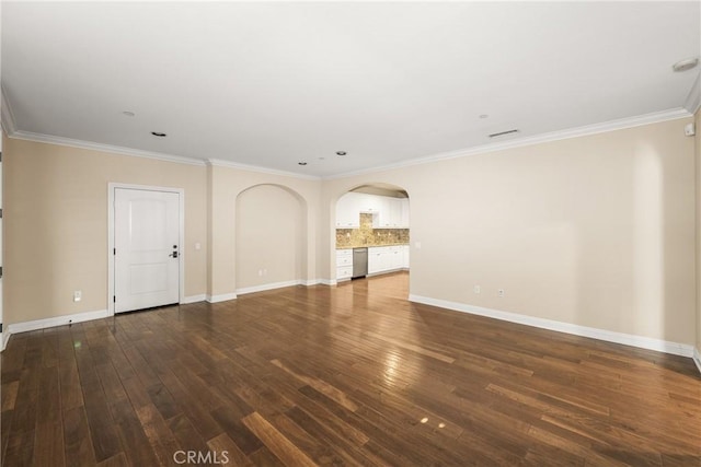 unfurnished living room featuring crown molding and dark wood-type flooring