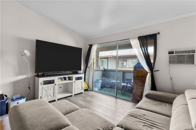 806 Coriander Dr Unit G, Torrance, CA 90502 - living room featuring an AC wall unit, wood finished floors, and vaulted ceiling