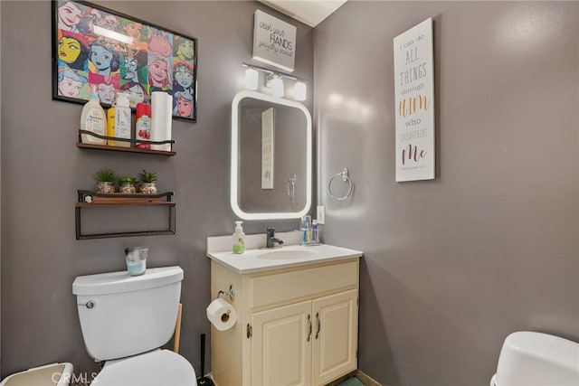 bathroom featuring vanity and toilet