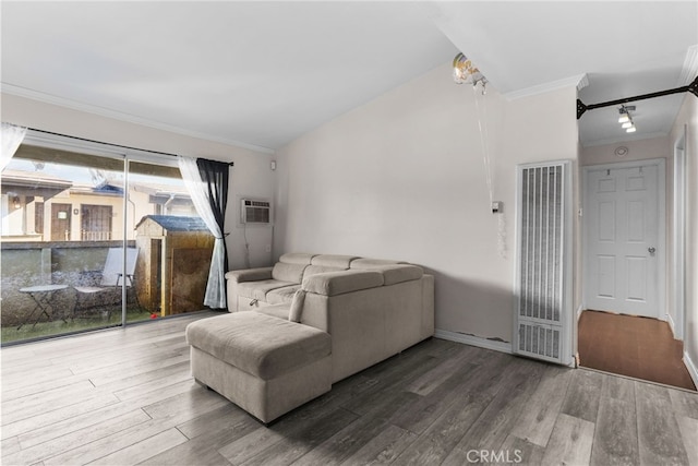 living room with a wall mounted AC, crown molding, and hardwood / wood-style flooring