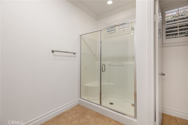 bathroom with tile patterned floors, walk in shower, and crown molding