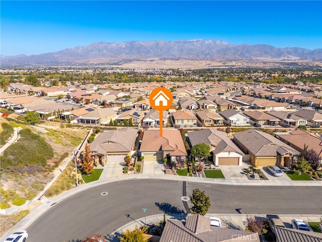 birds eye view of property featuring a mountain view