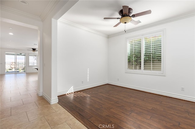 empty room featuring ceiling fan, ornamental molding, and light hardwood / wood-style flooring