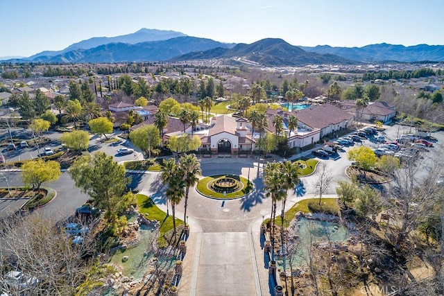 birds eye view of property with a mountain view