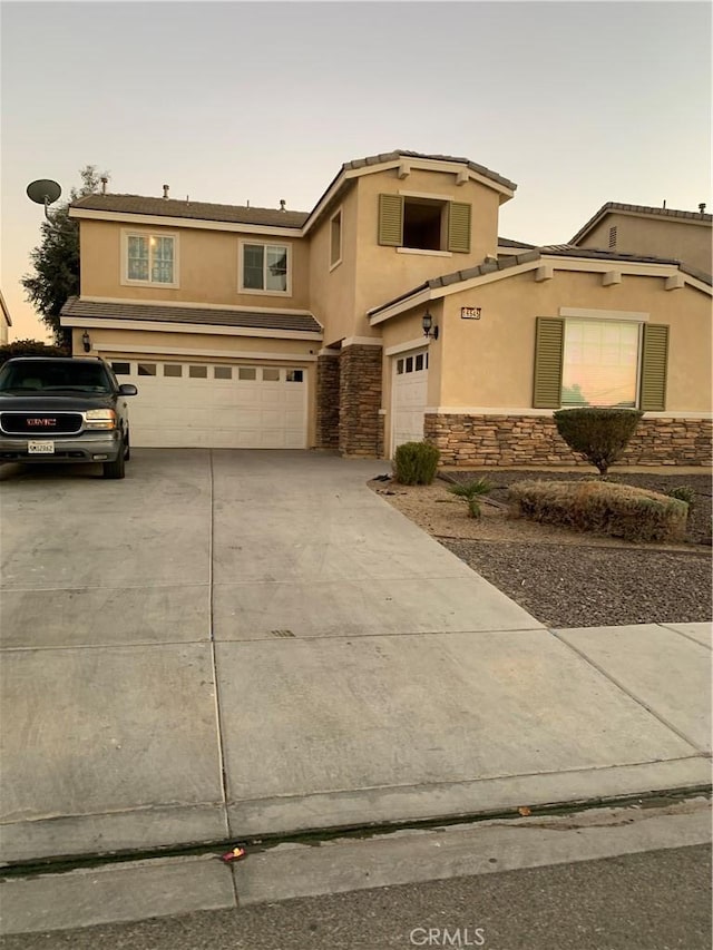 view of front of home with a garage