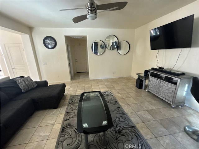 living room featuring ceiling fan and light tile patterned floors