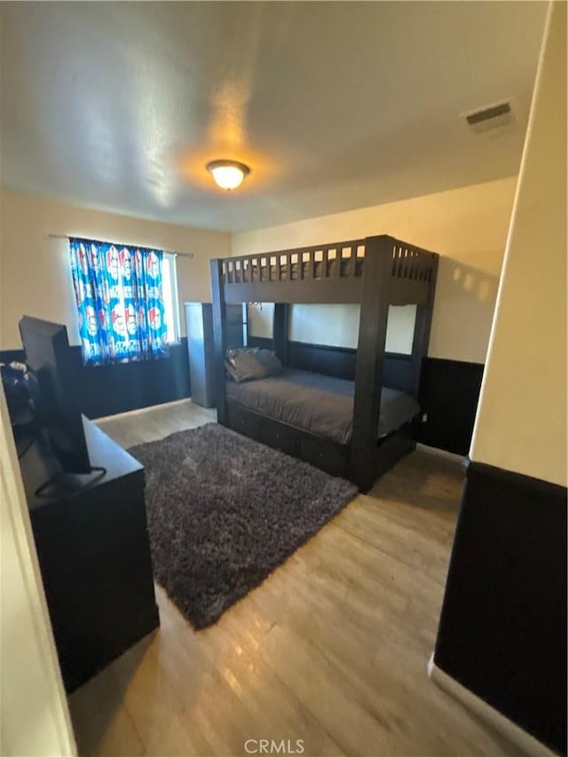 bedroom with hardwood / wood-style floors