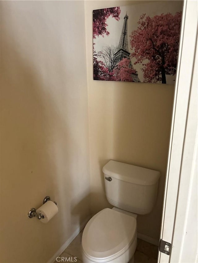 bathroom featuring tile patterned floors and toilet