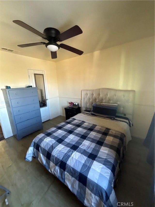 bedroom with dark carpet and ceiling fan