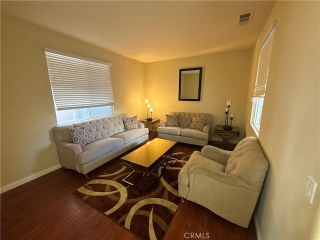 living room featuring dark hardwood / wood-style flooring