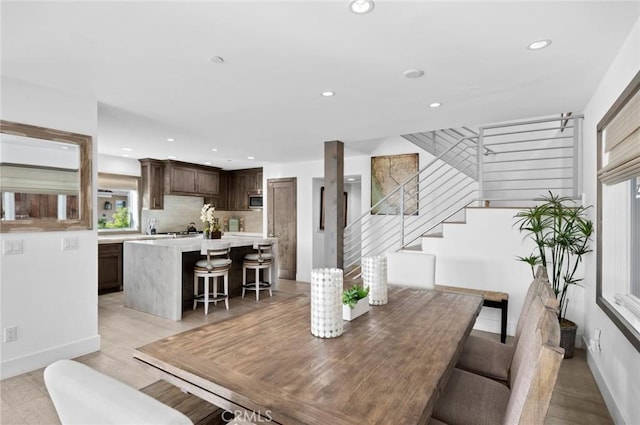 dining area with light hardwood / wood-style floors