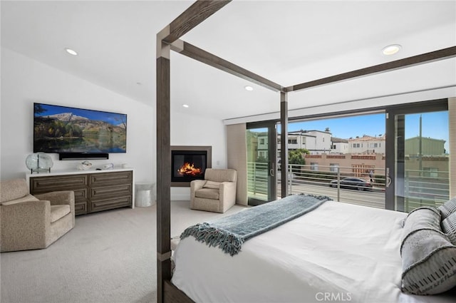 carpeted bedroom featuring lofted ceiling