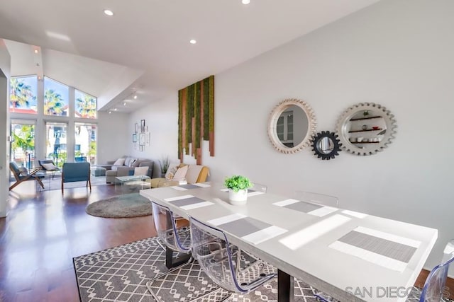 interior space featuring hardwood / wood-style flooring and high vaulted ceiling