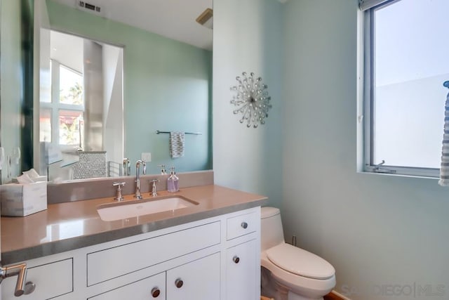 bathroom with vanity and toilet