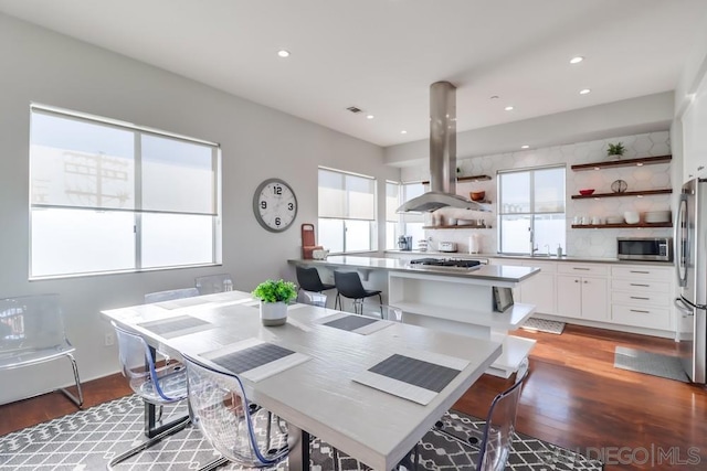 dining area with hardwood / wood-style flooring