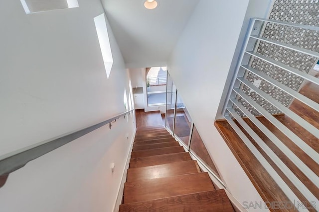 stairway featuring hardwood / wood-style floors