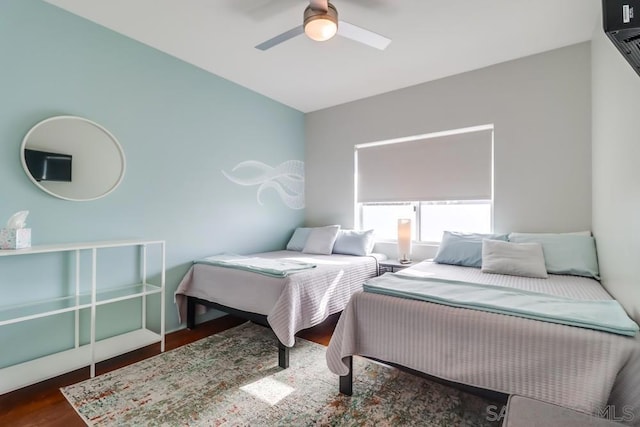 bedroom featuring dark hardwood / wood-style floors and ceiling fan