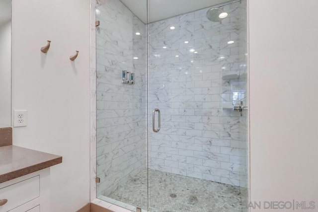 bathroom featuring vanity and walk in shower